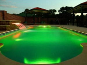 milano-fiberglass-swimming-pool-at-night-with-green-lighting
